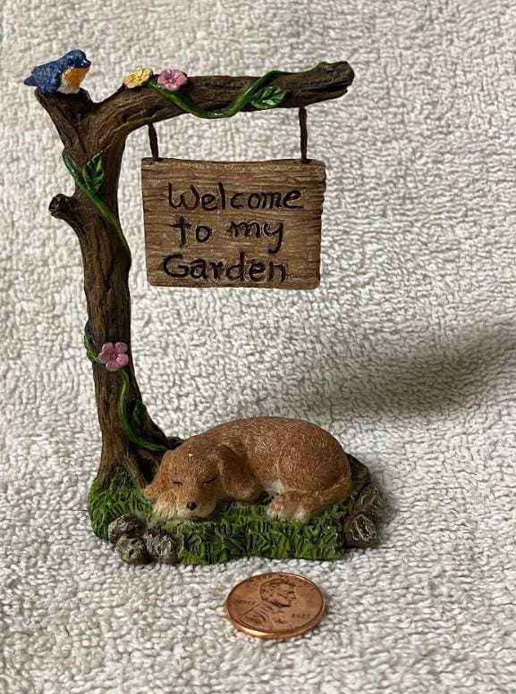 Miniature Dog Sleeping under a Welcome Sign Fairy Garden Figurine